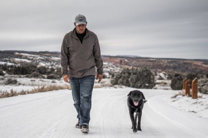 man and service dog