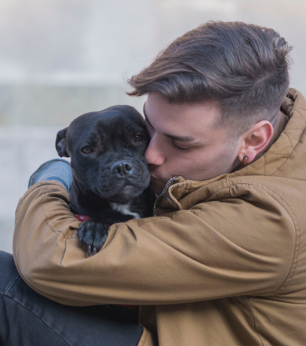 Man hugging his Service Dog