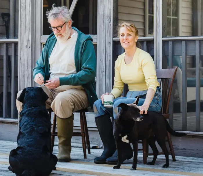 Seniors with service dogs outdoors