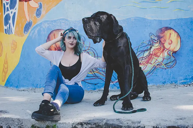 Woman with large service dog.